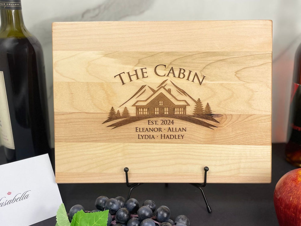 light colored cutting board with mountain cabin design #1