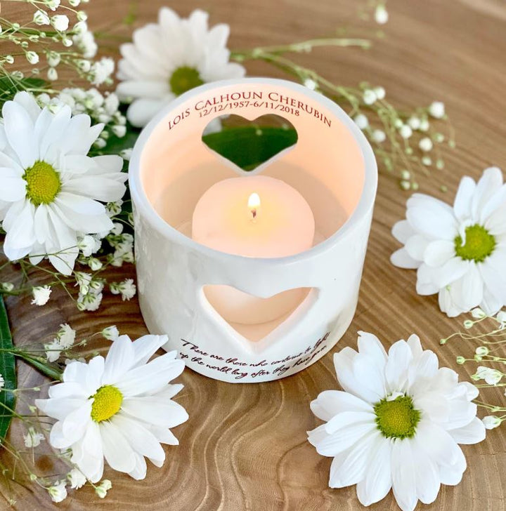 Candle in a heart-shaped holder personalized with name and dates