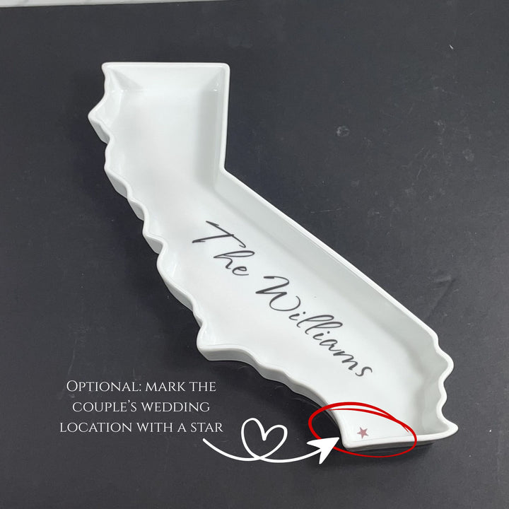 White ceramic dish shaped like the state of California with 'The Williams' imprinted on a black background.