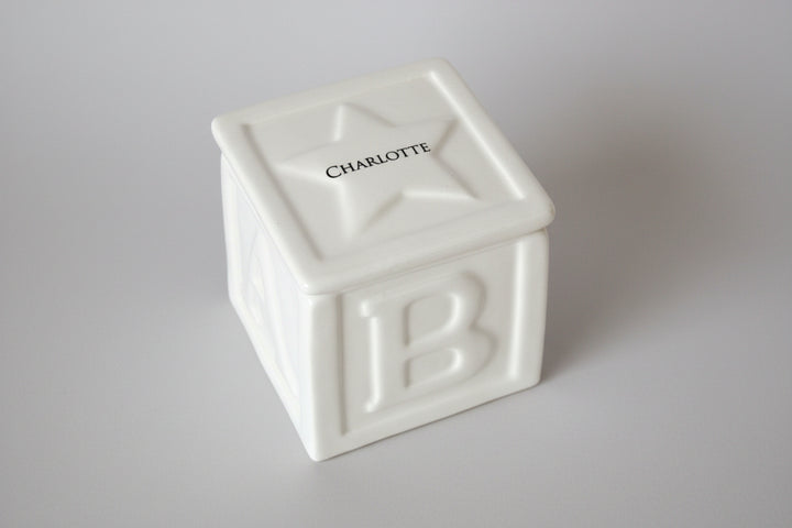 White ceramic ABC block with 'Charlotte' imprinted on the top - personalized to your child