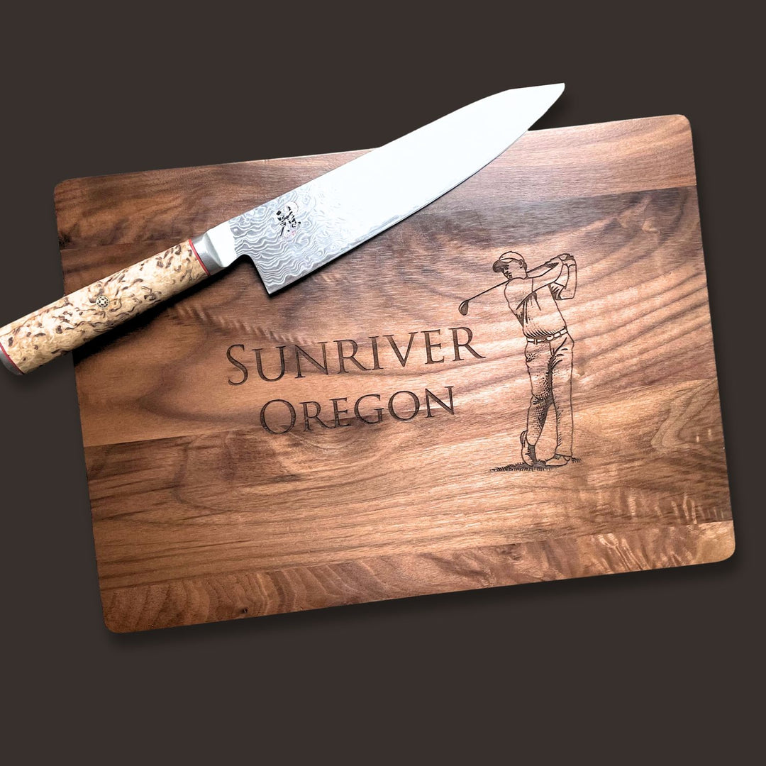 Wooden cutting board with engraved 'Sunriver Oregon' and a golf swing illustration.