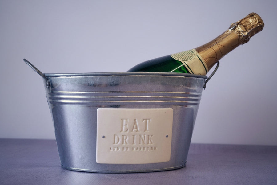 Metal ice bucket with a bottle of champagne 