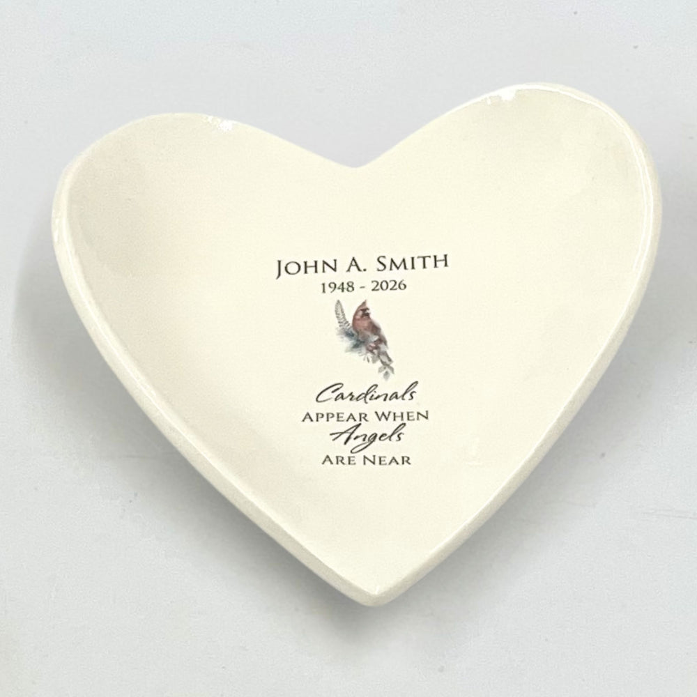 Heart-shaped ceramic catchall with personalized text and cardinal illustration