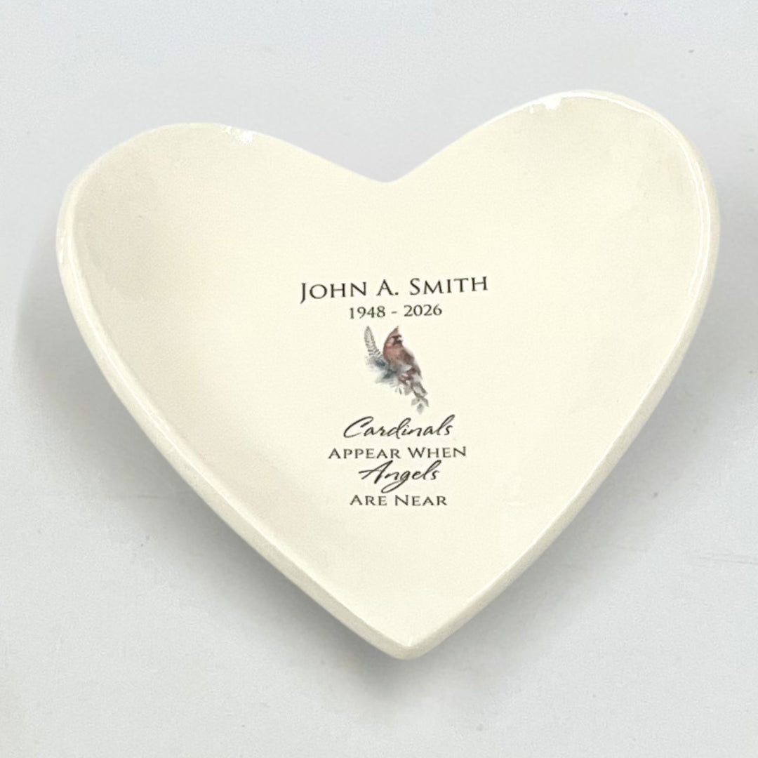 Heart-shaped ceramic catchall with personalized text and cardinal illustration