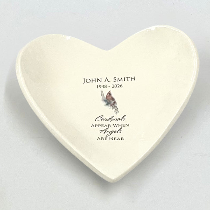 Heart-shaped ceramic catchall with personalized text and cardinal illustration