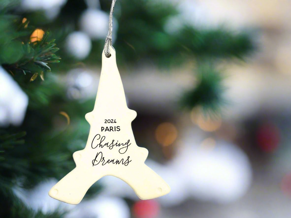 white ornament handmade with 2024 Paris Chasing Dreams in black text