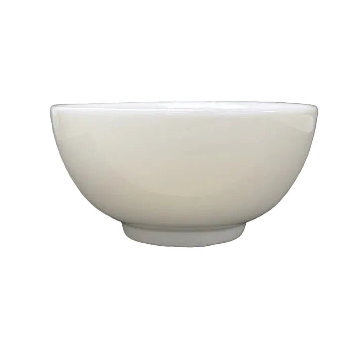 White ceramic bowl on a beige background