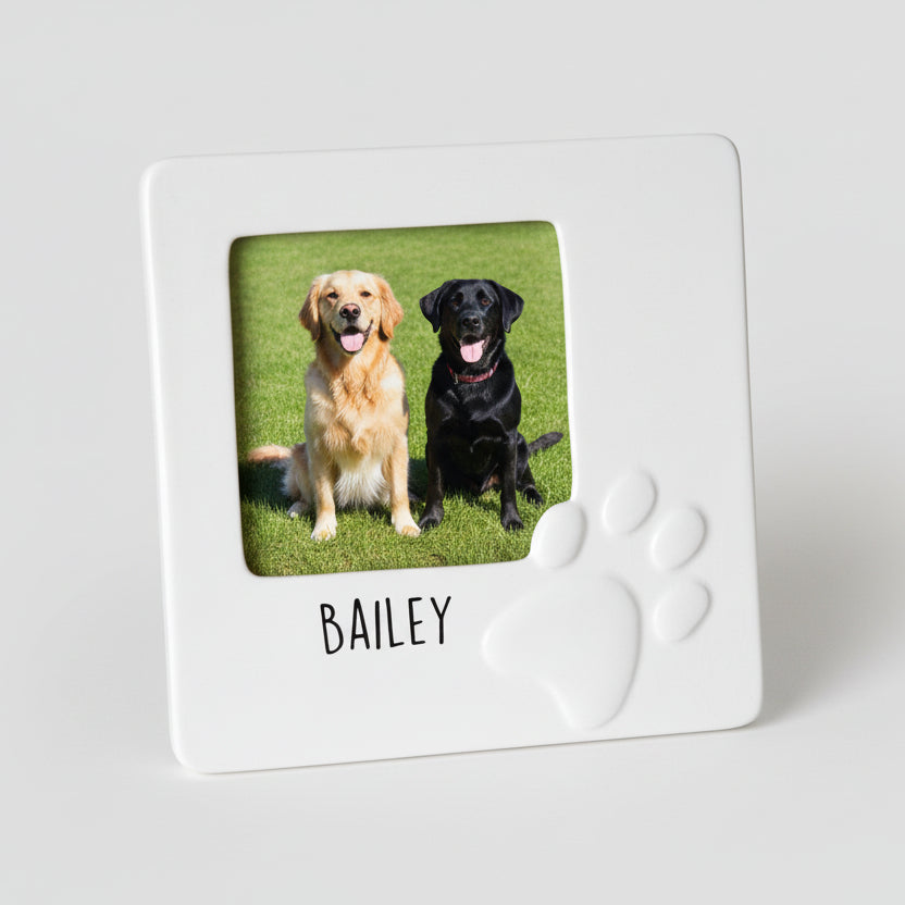 White ceramic photo frame with a picture of a dog named Bailey