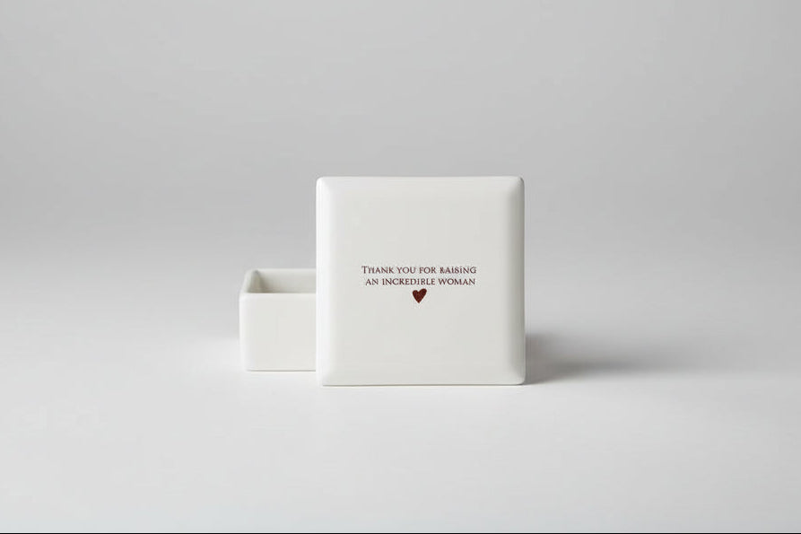 White ceramic coaster with 'Thank you for raising an incredible woman' text 