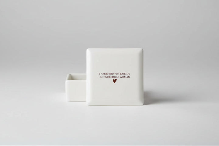 White ceramic coaster with 'Thank you for raising an incredible woman' text 