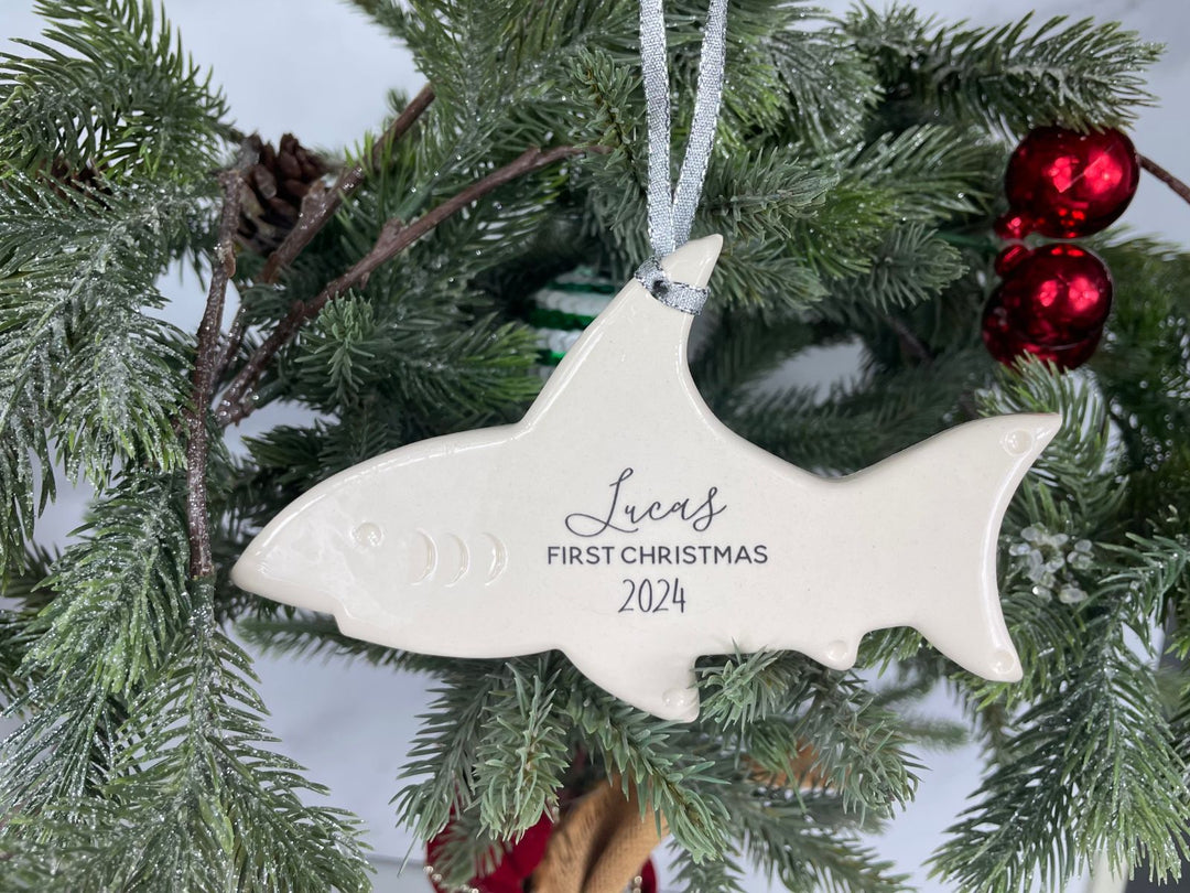 shark ornament hanging on a tree