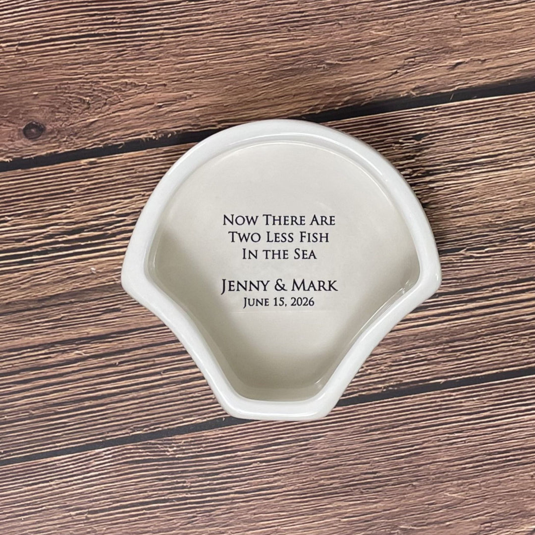Personalized ceramic coaster with engraved text on a wooden surface