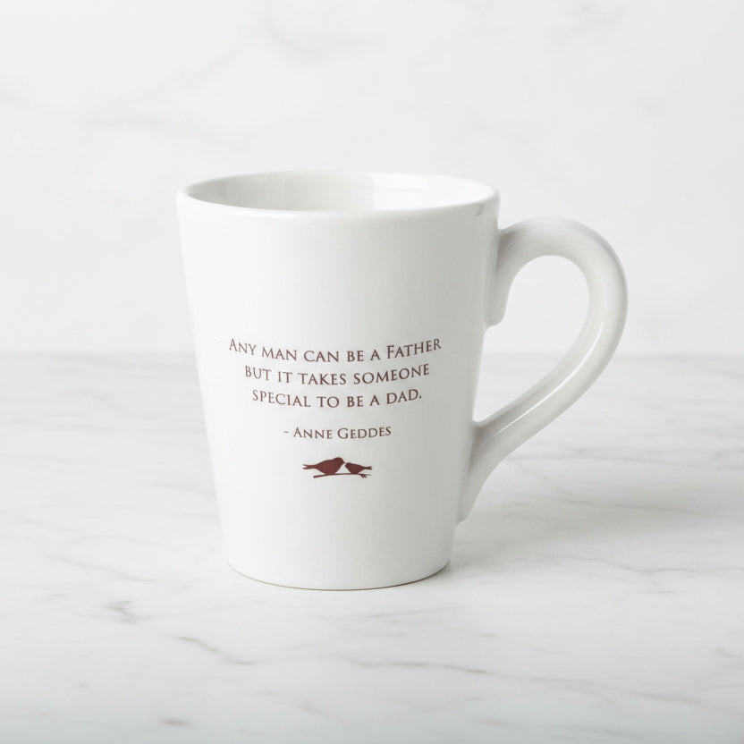 White mug with a quote on a wooden surface