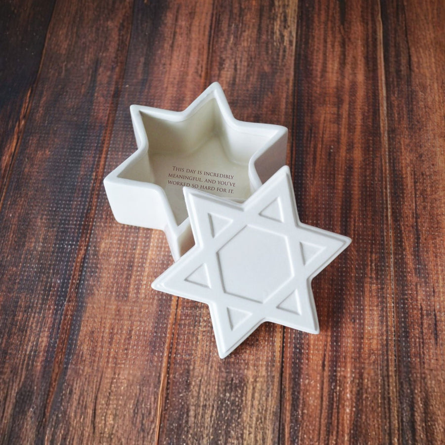 Star-shaped ceramic container on a wooden surface