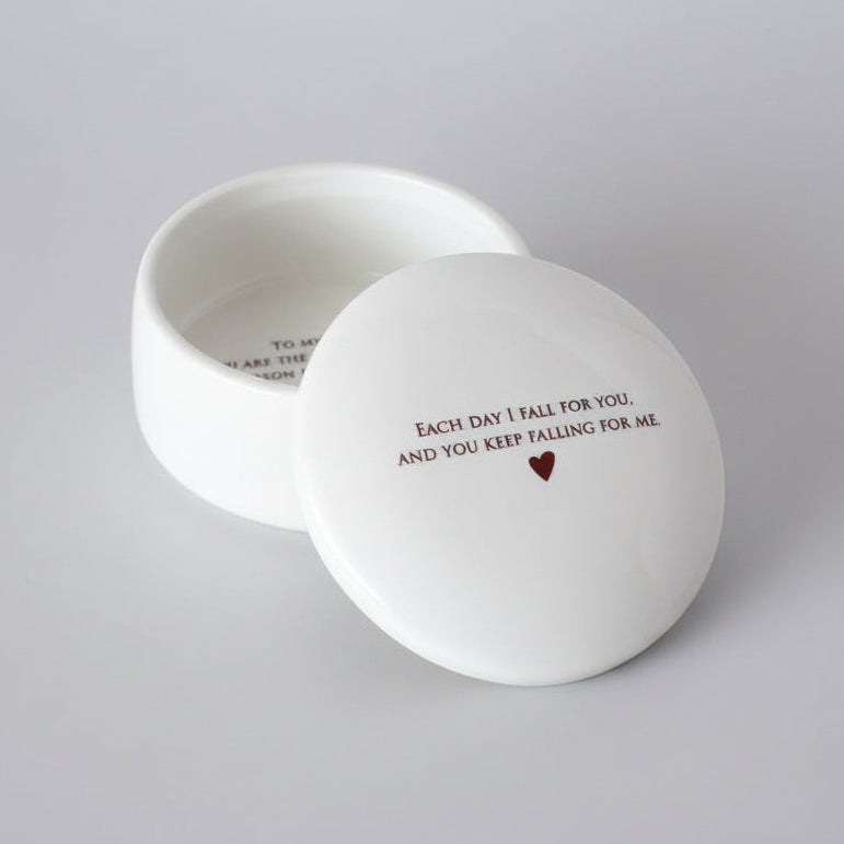 Round white container with romantic text